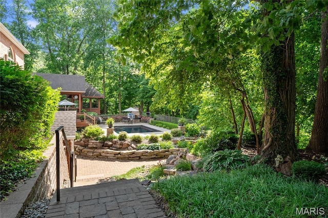 view of yard featuring fence and a patio area