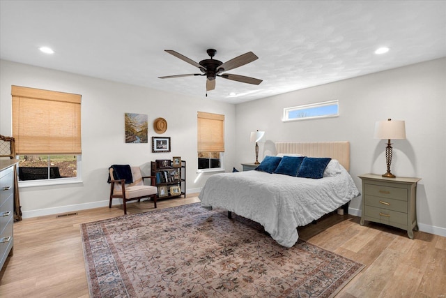 bedroom with recessed lighting, baseboards, light wood-type flooring, and a ceiling fan