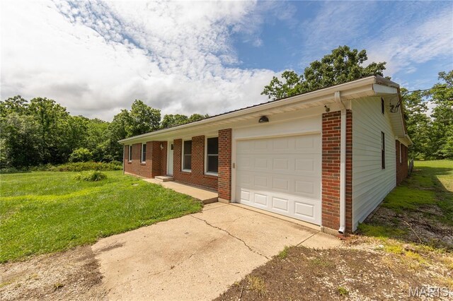 1575 County Road 3290, Salem, MO 65560 - ranch-style house featuring brick siding, a garage, a front yard, and driveway