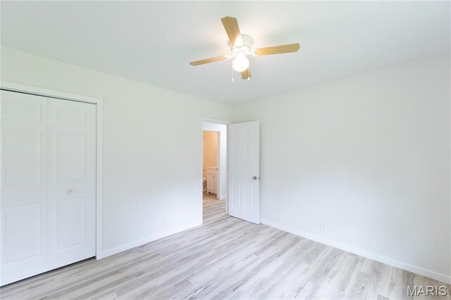 1575 County Road 3290, Salem, MO 65560 - unfurnished bedroom featuring light wood-style floors, a closet, baseboards, and a ceiling fan