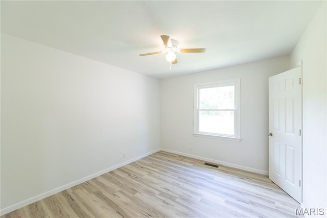 1575 County Road 3290, Salem, MO 65560 - spare room featuring light wood-style flooring, a ceiling fan, and baseboards