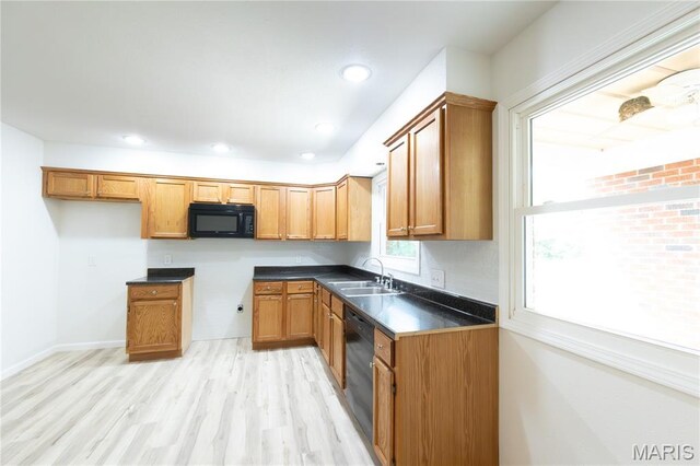 1575 County Road 3290, Salem, MO 65560 - kitchen with black appliances, a sink, light wood-style flooring, dark countertops, and recessed lighting