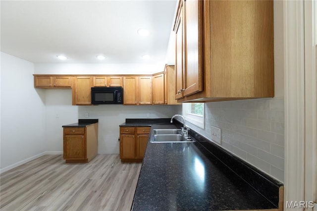 1575 County Road 3290, Salem, MO 65560 - kitchen with a sink, black microwave, dark countertops, brown cabinets, and recessed lighting