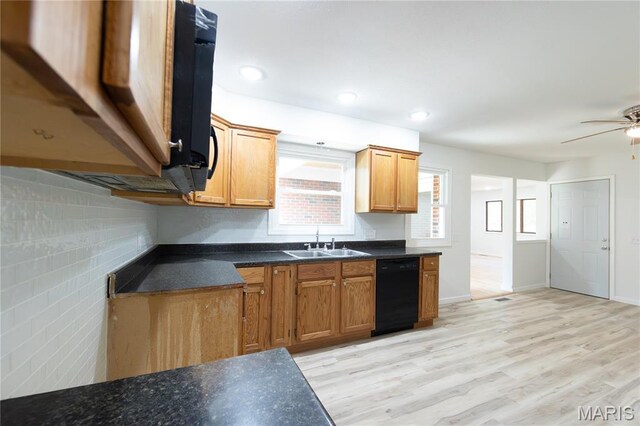 1575 County Road 3290, Salem, MO 65560 - kitchen with black dishwasher, a sink, dark countertops, light wood-style floors, and a ceiling fan