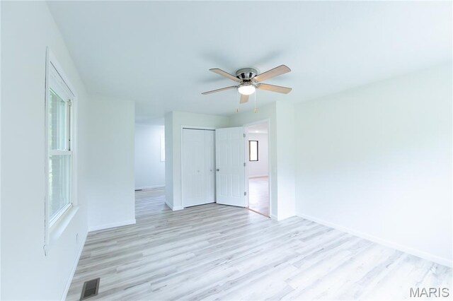 1575 County Road 3290, Salem, MO 65560 - spare room featuring a ceiling fan, light wood-style floors, and healthy amount of natural light