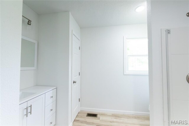 1575 County Road 3290, Salem, MO 65560 - bathroom with vanity, wood finished floors, and baseboards