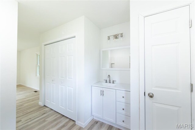 1575 County Road 3290, Salem, MO 65560 - bathroom featuring wood finished floors, vanity, and baseboards