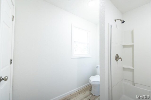1575 County Road 3290, Salem, MO 65560 - full bathroom with a stall shower, toilet, wood finished floors, and baseboards