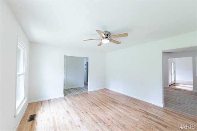 1575 County Road 3290, Salem, MO 65560 - unfurnished room featuring a ceiling fan, light wood-type flooring, healthy amount of natural light, and baseboards