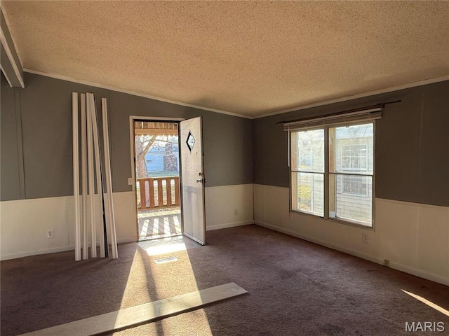 905 N Olive St, Saint Elmo, IL 62458 - empty room with a textured ceiling, carpet, and ornamental molding