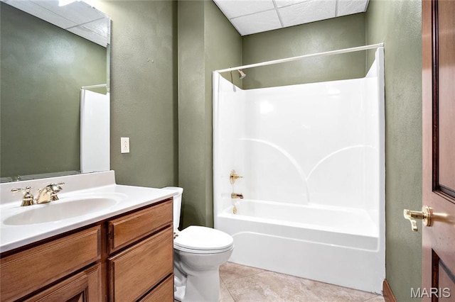 bathroom with bathtub / shower combination, toilet, vanity, and tile patterned flooring