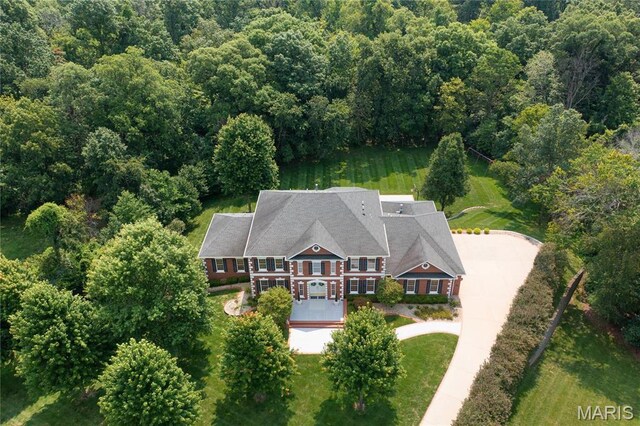 view of subject property featuring a forest