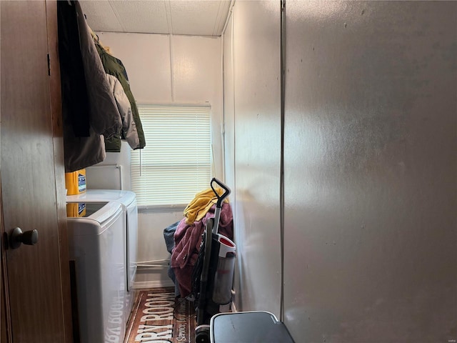 clothes washing area featuring separate washer and dryer