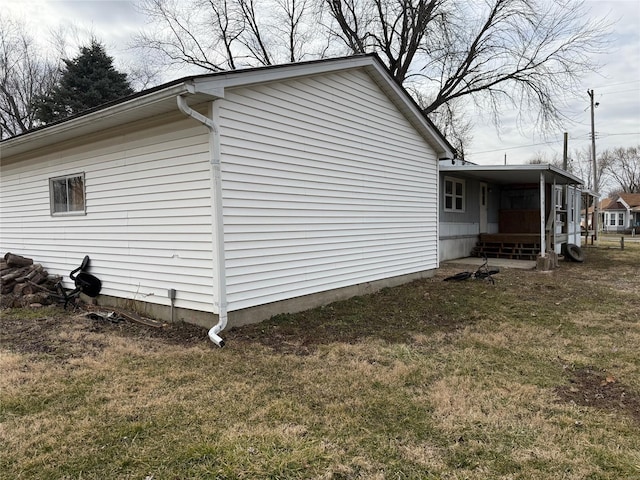 view of property exterior with a yard