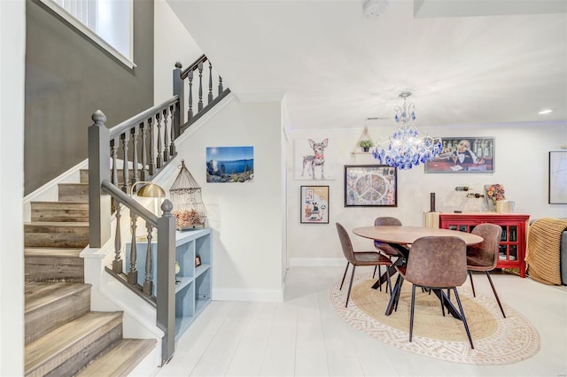 4561 Laclede Ave Unit B, Saint Louis, MO 63108 - dining room with stairs, a chandelier, baseboards, and crown molding