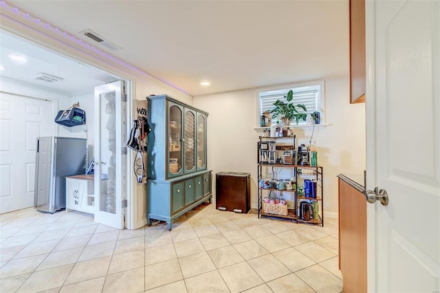 4561 Laclede Ave Unit B, Saint Louis, MO 63108 - hallway with light tile patterned floors and recessed lighting