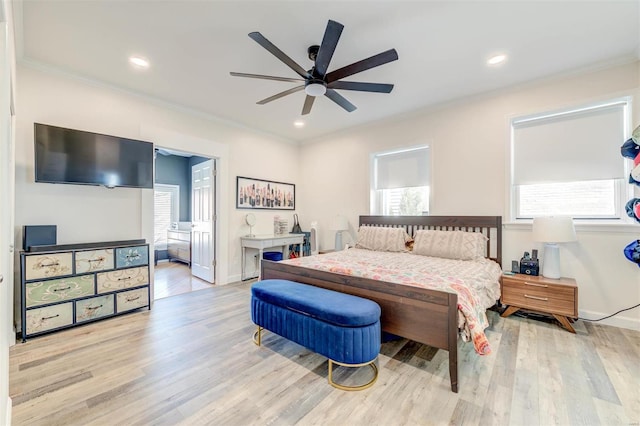 4561 Laclede Ave Unit B, Saint Louis, MO 63108 - bedroom with multiple windows, ornamental molding, wood finished floors, baseboards, and recessed lighting