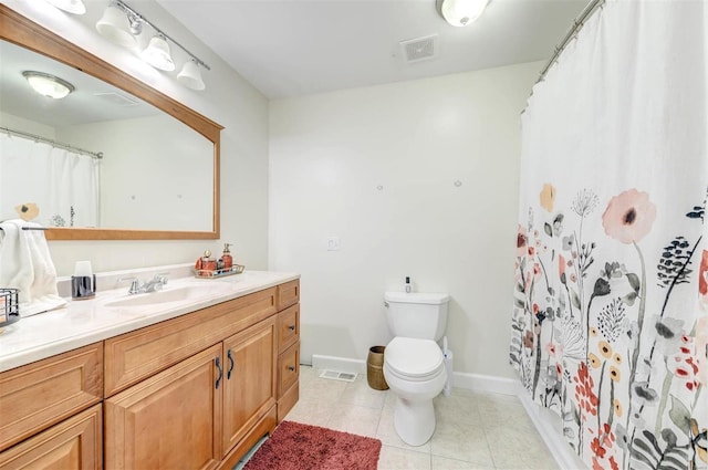 4561 Laclede Ave Unit B, Saint Louis, MO 63108 - bathroom featuring toilet, tile patterned floors, vanity, and baseboards