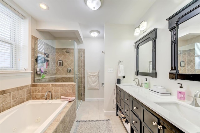 4561 Laclede Ave Unit B, Saint Louis, MO 63108 - full bath with a tub with jets, a shower stall, tile patterned floors, double vanity, and baseboards