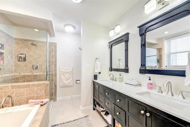4561 Laclede Ave Unit B, Saint Louis, MO 63108 - full bath with a shower stall, tiled tub, tile patterned floors, double vanity, and baseboards