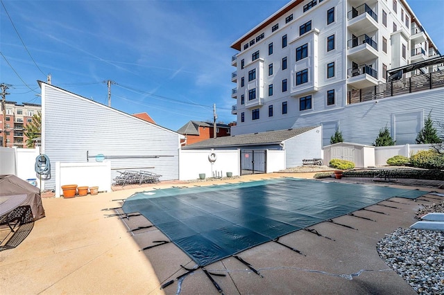 4561 Laclede Ave Unit B, Saint Louis, MO 63108 - community pool featuring a patio area and fence
