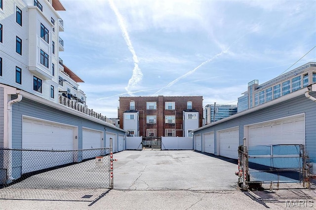 4561 Laclede Ave Unit B, Saint Louis, MO 63108 - view of asphalt road featuring community garages