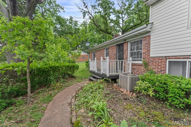 10267 Thornwood Dr, Ladue, MO 63124 - view of yard with central AC and a wooden deck