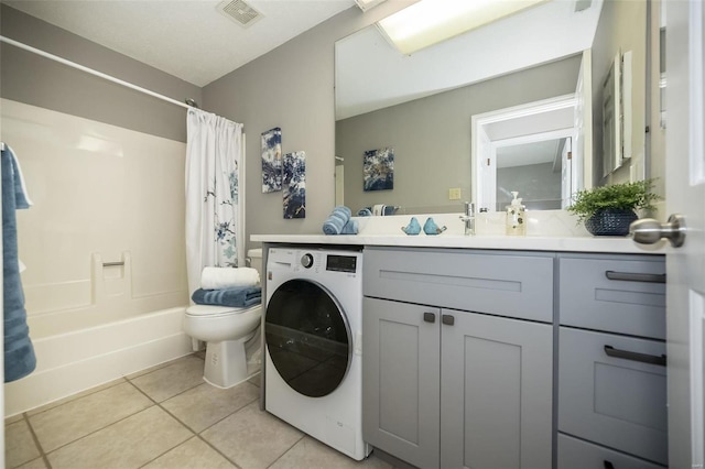 full bathroom featuring washer / clothes dryer, tile patterned flooring, vanity, toilet, and shower / bathtub combination with curtain