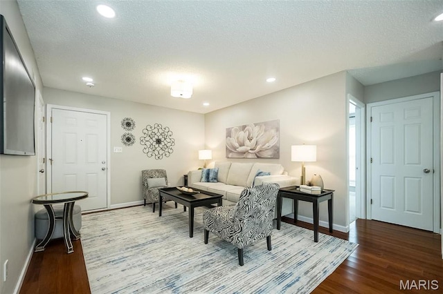 942 Guelbreth Ln Unit 112, Saint Louis, MO 63141 - living room with wood finished floors, recessed lighting, and a textured ceiling