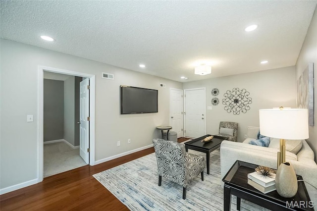 942 Guelbreth Ln Unit 112, Saint Louis, MO 63141 - living area with wood finished floors, recessed lighting, and a textured ceiling