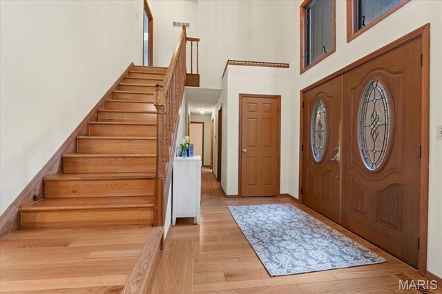 1346 Forest Splendor Trl, Wildwood, MO 63021 - entrance foyer featuring a towering ceiling, stairs, and light wood-style floors