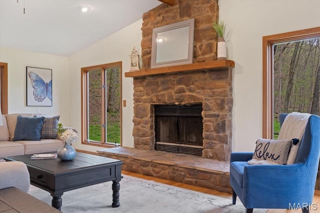 1346 Forest Splendor Trl, Wildwood, MO 63021 - living area featuring vaulted ceiling, wood finished floors, and a fireplace