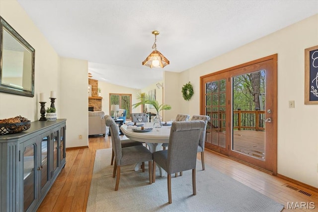 1346 Forest Splendor Trl, Wildwood, MO 63021 - dining room with plenty of natural light, light wood-style floors, and baseboards