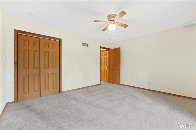 1346 Forest Splendor Trl, Wildwood, MO 63021 - unfurnished bedroom featuring light carpet, baseboards, a closet, and a ceiling fan
