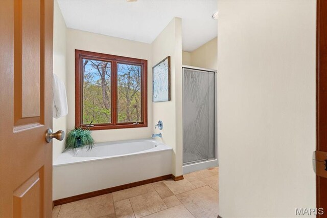 1346 Forest Splendor Trl, Wildwood, MO 63021 - full bathroom with a stall shower, a garden tub, baseboards, and tile patterned flooring