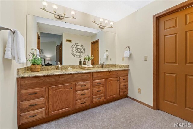 1346 Forest Splendor Trl, Wildwood, MO 63021 - full bathroom featuring carpet floors, double vanity, and baseboards