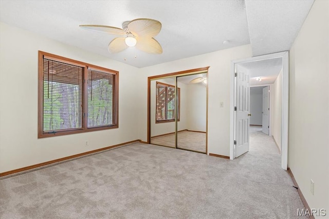 1346 Forest Splendor Trl, Wildwood, MO 63021 - unfurnished bedroom with carpet, baseboards, a closet, and a ceiling fan