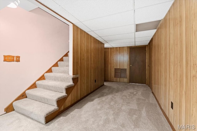 1346 Forest Splendor Trl, Wildwood, MO 63021 - finished basement with carpet, wood walls, stairway, and a paneled ceiling