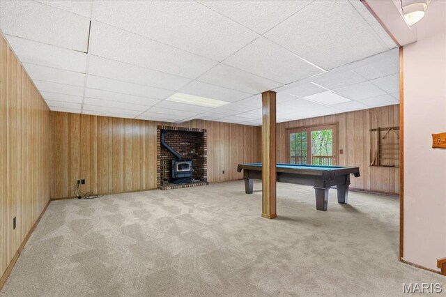 1346 Forest Splendor Trl, Wildwood, MO 63021 - rec room with carpet flooring, a wood stove, a drop ceiling, wooden walls, and pool table