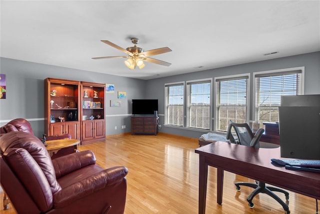 home office featuring ceiling fan and light wood-type flooring
