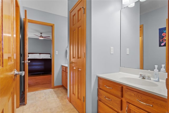 bathroom with vanity, ensuite bathroom, and ceiling fan