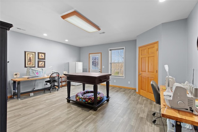 office area with light wood-style floors, recessed lighting, and baseboards