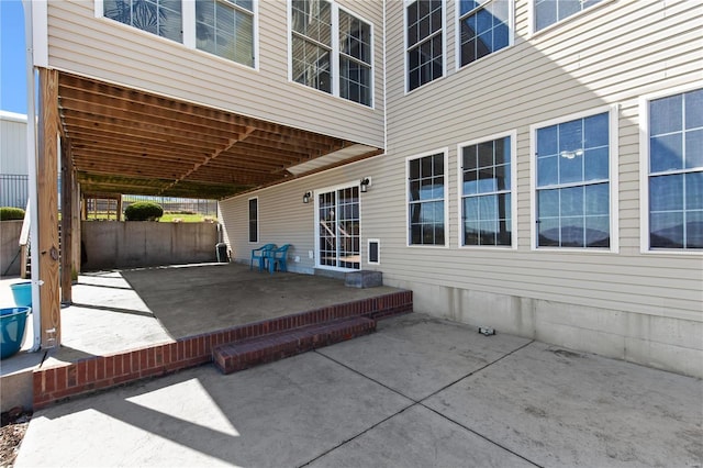 view of patio featuring fence