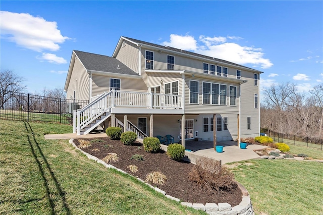 back of property with stairs, a patio, and a wooden deck