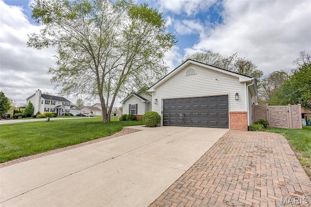ranch-style home with driveway, brick siding, and an attached garage