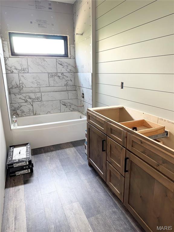 bathroom with wood finished floors and vanity