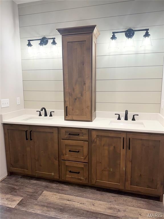 615 Scottsvale Dr, Rolla, MO 65401 - full bathroom with wood finished floors, double vanity, and wooden walls