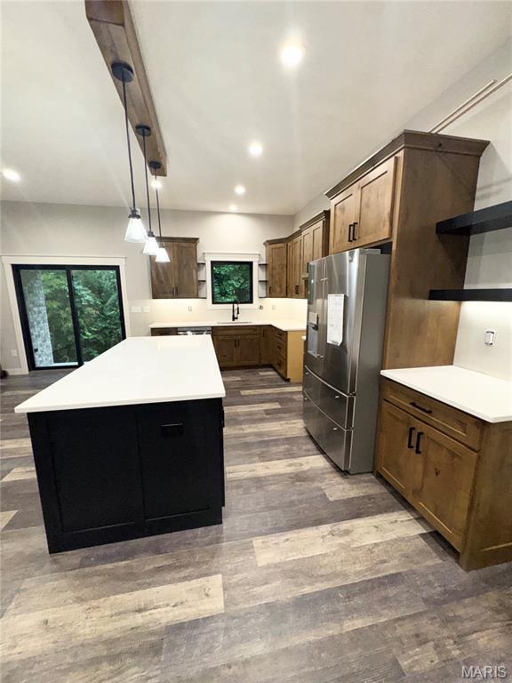615 Scottsvale Dr, Rolla, MO 65401 - kitchen with open shelves, stainless steel fridge with ice dispenser, a sink, dark wood-style flooring, and a center island