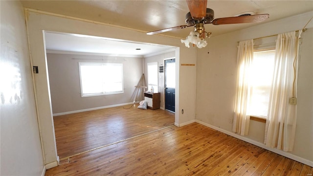 204 W 8th St, Kennett, MO 63857 - spare room with ceiling fan, ornamental molding, hardwood / wood-style floors, and baseboards
