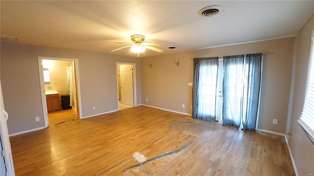 204 W 8th St, Kennett, MO 63857 - unfurnished room with light wood-type flooring, a ceiling fan, and baseboards